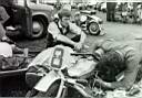 Ned Newman watching an engine strip on Crickie's outfit at Crystal Palace