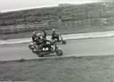 Crystal Palace. 'Boob' in his usual comic pose before a race.  John Taylor on 'Yellow Peril' in background.  Other riders unknown